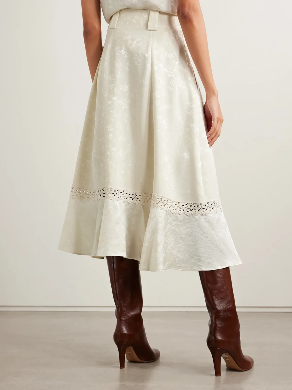 Back view of the Maison Mayle Amparo Pleated Lace-trimmed Silk-satin Jacquard Midi Skirt