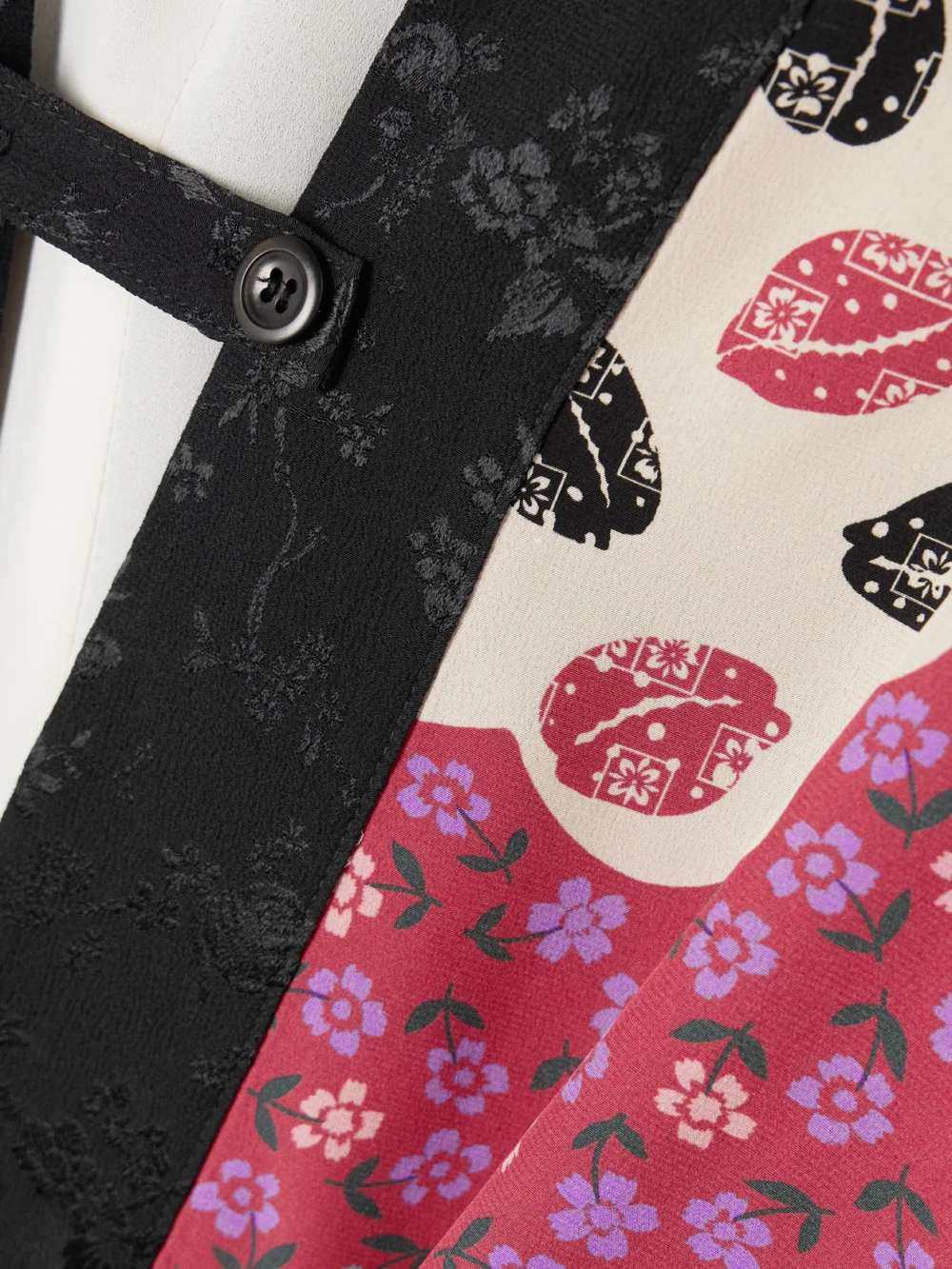 Close-up detail of the Maison Mayle Sunset Tasseled Lace-trimmed Floral-print Silk Crepe De Chine Jacket