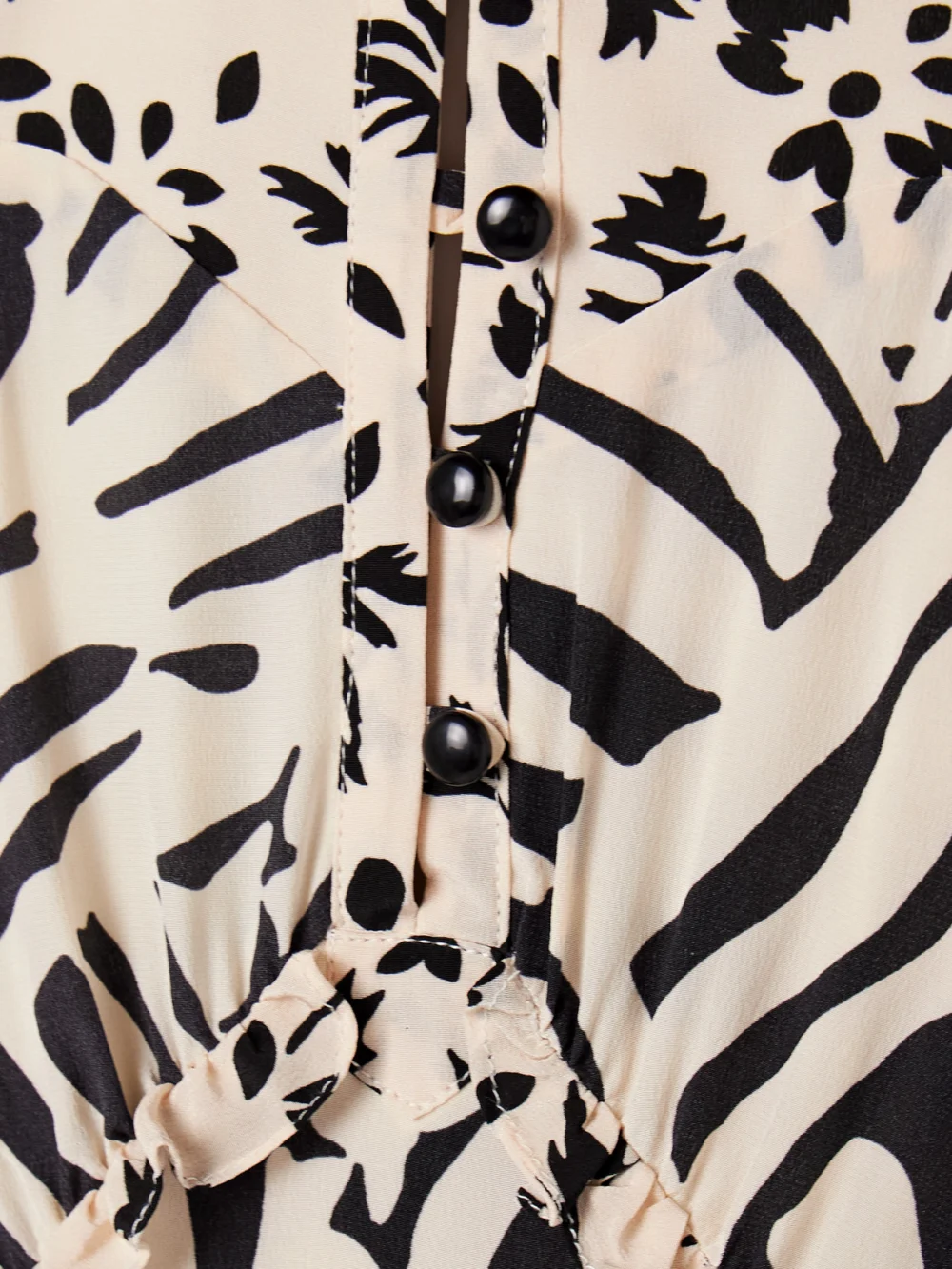 Close-up detail of the Maison Mayle Valentine Ruffled Printed Silk-crepe Halterneck Maxi Dress