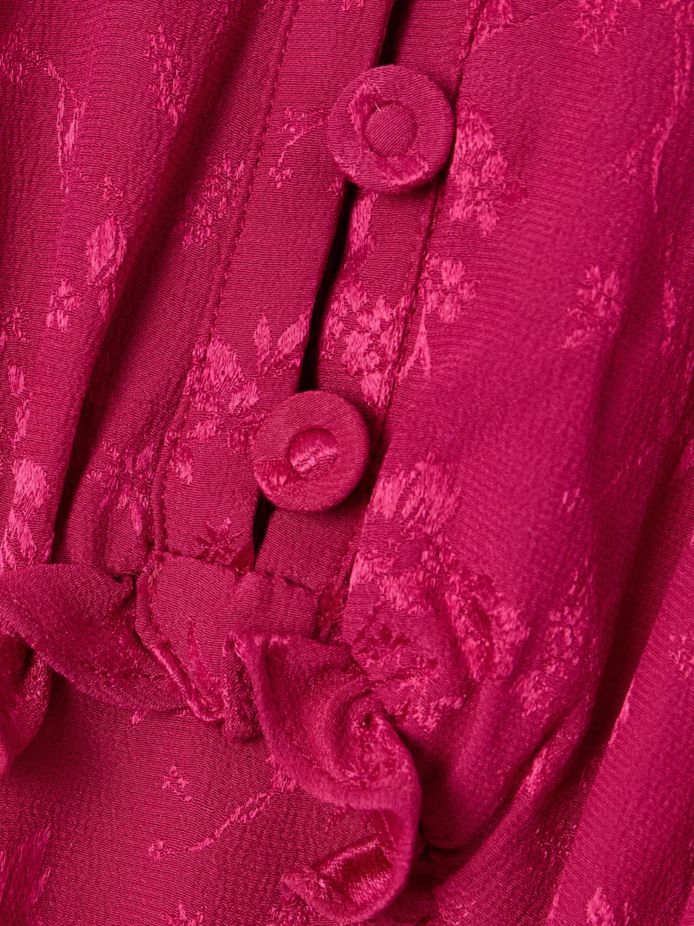 Close-up detail of the Maison Mayle Valentine Ruffled Silk-jacquard Halterneck Maxi Dress