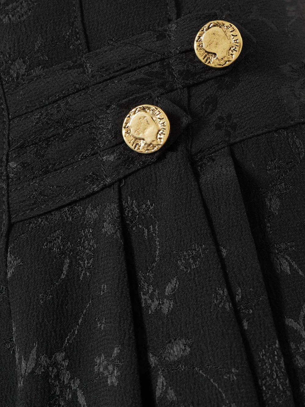 Close-up detail of the Maison Mayle Vali Embellished Pleated Silk-jacquard Tapered Pants