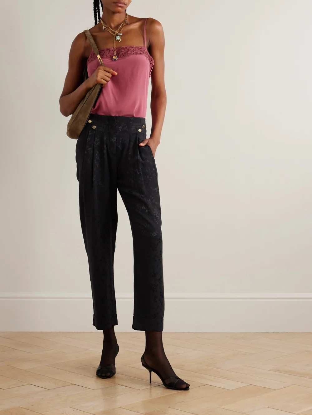 Maison Mayle Vali Embellished Pleated Silk-jacquard Tapered Pants, worn by a model