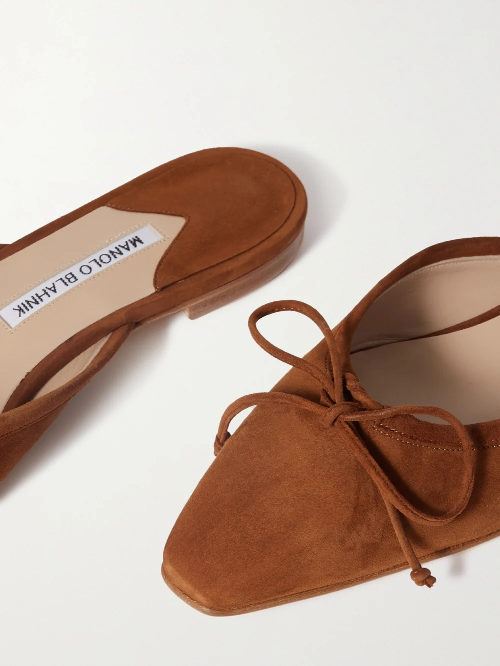 Close-up detail of the Manolo Blahnik Ballerimu Bow-detailed Suede Ballet Flats