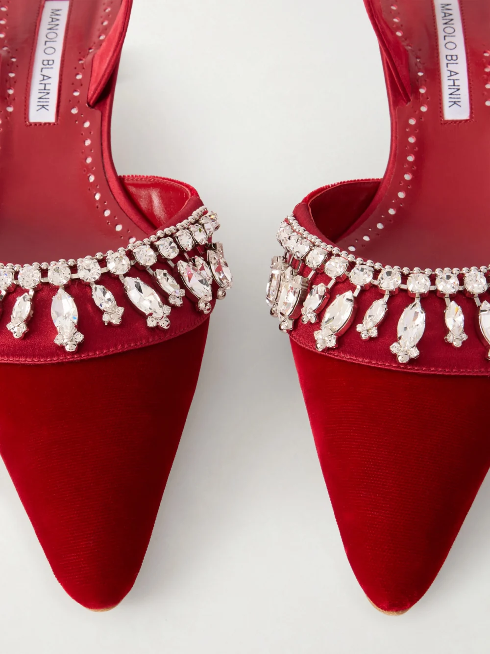 Close-up detail of the Manolo Blahnik Bequila 30 Embellished Velvet Slingback Pumps