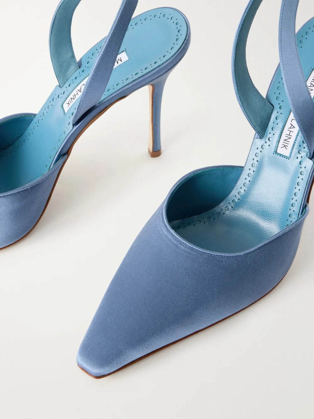 Close-up detail of the Manolo Blahnik Borelapla 105 Satin Slingback Pumps