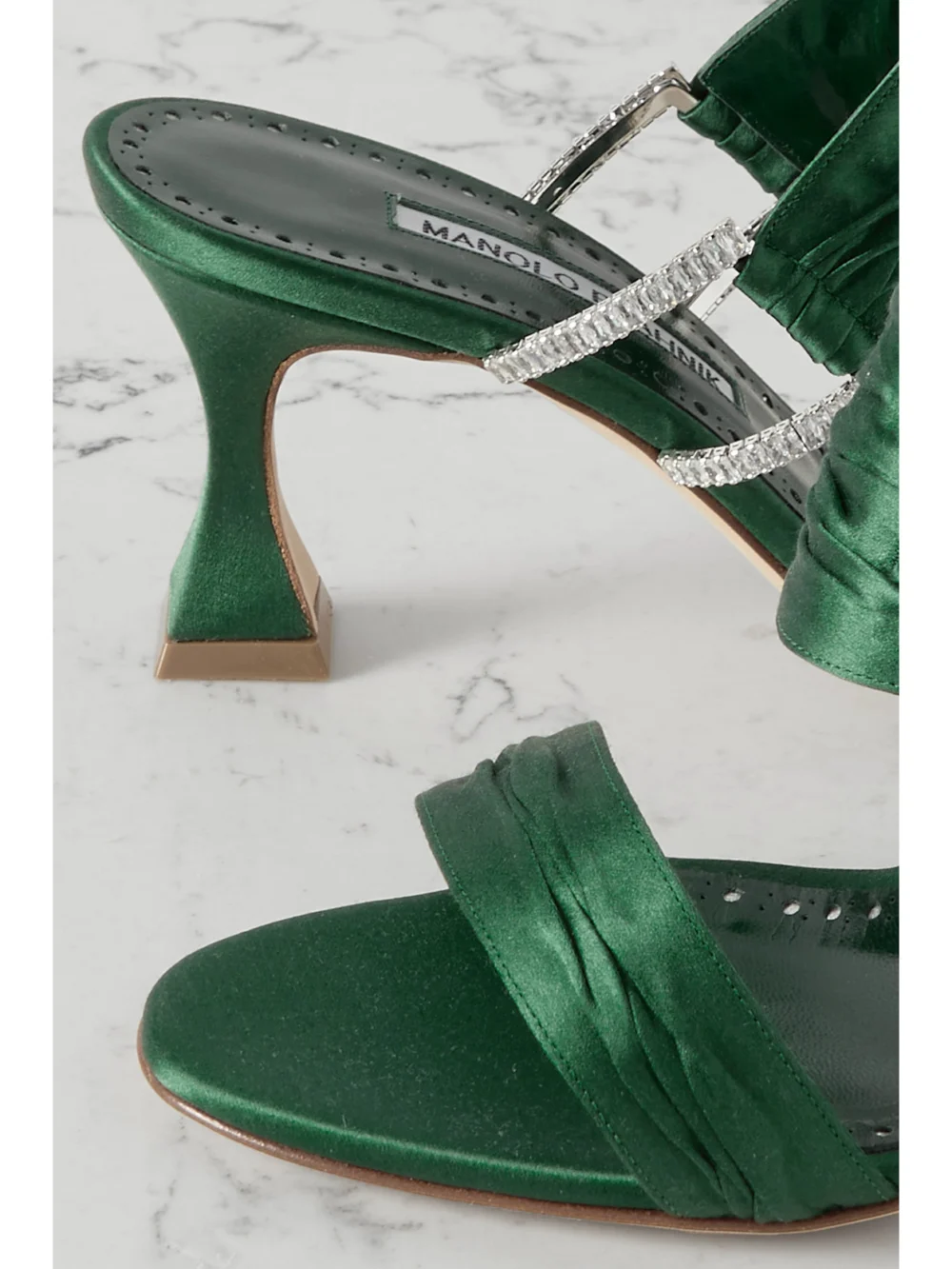 Close-up detail of the Manolo Blahnik Chinap 70 Crystal-embellished Gathered Satin Mules