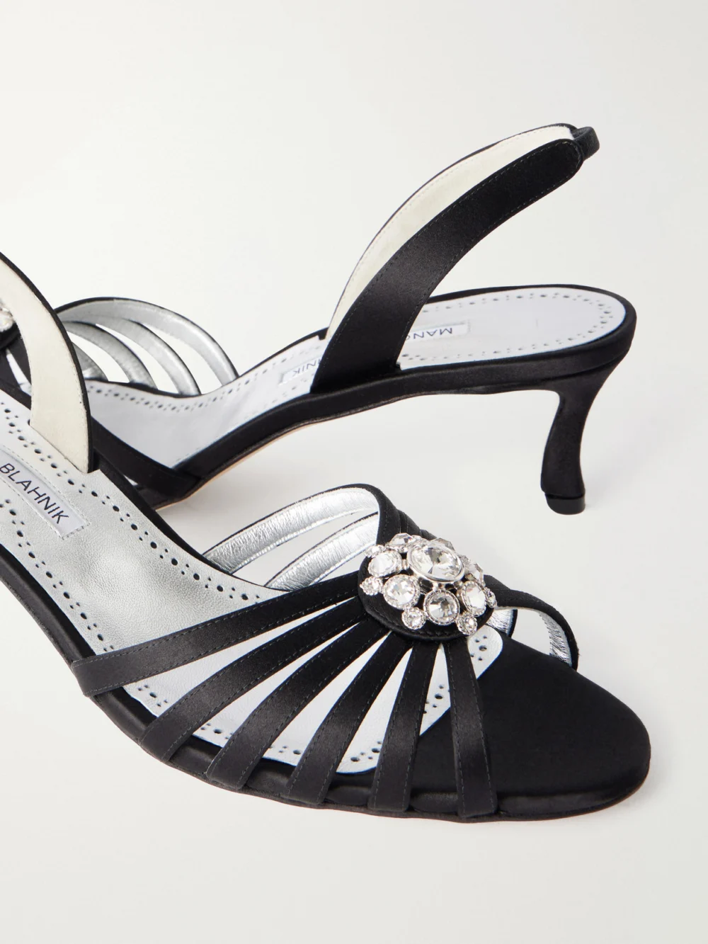 Close-up detail of the Manolo Blahnik Fulmasli 50 Crystal-embellished Satin Sandals