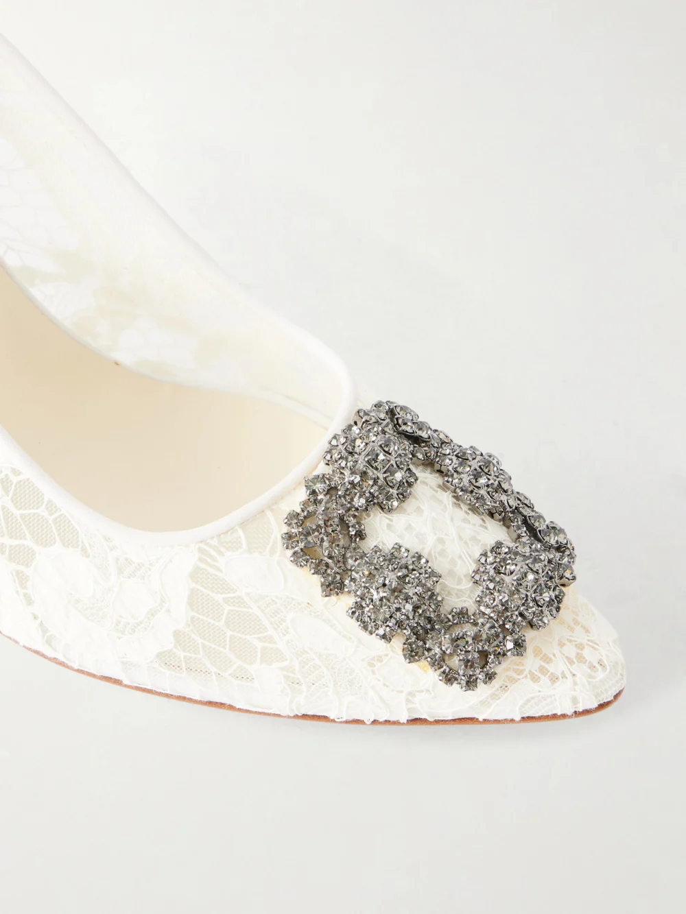 Close-up detail of the Manolo Blahnik Hangisi 90 Crystal-embellished Corded Lace Pumps