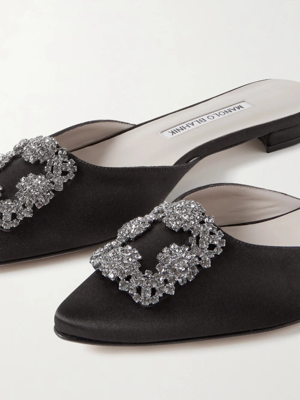 Close-up detail of the Manolo Blahnik Hangisi Crystal-embellished Satin Slippers