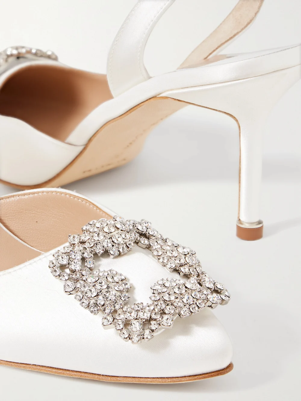 Close-up detail of the Manolo Blahnik Hangisli 70 Crystal-embellished Satin Slingback Pumps