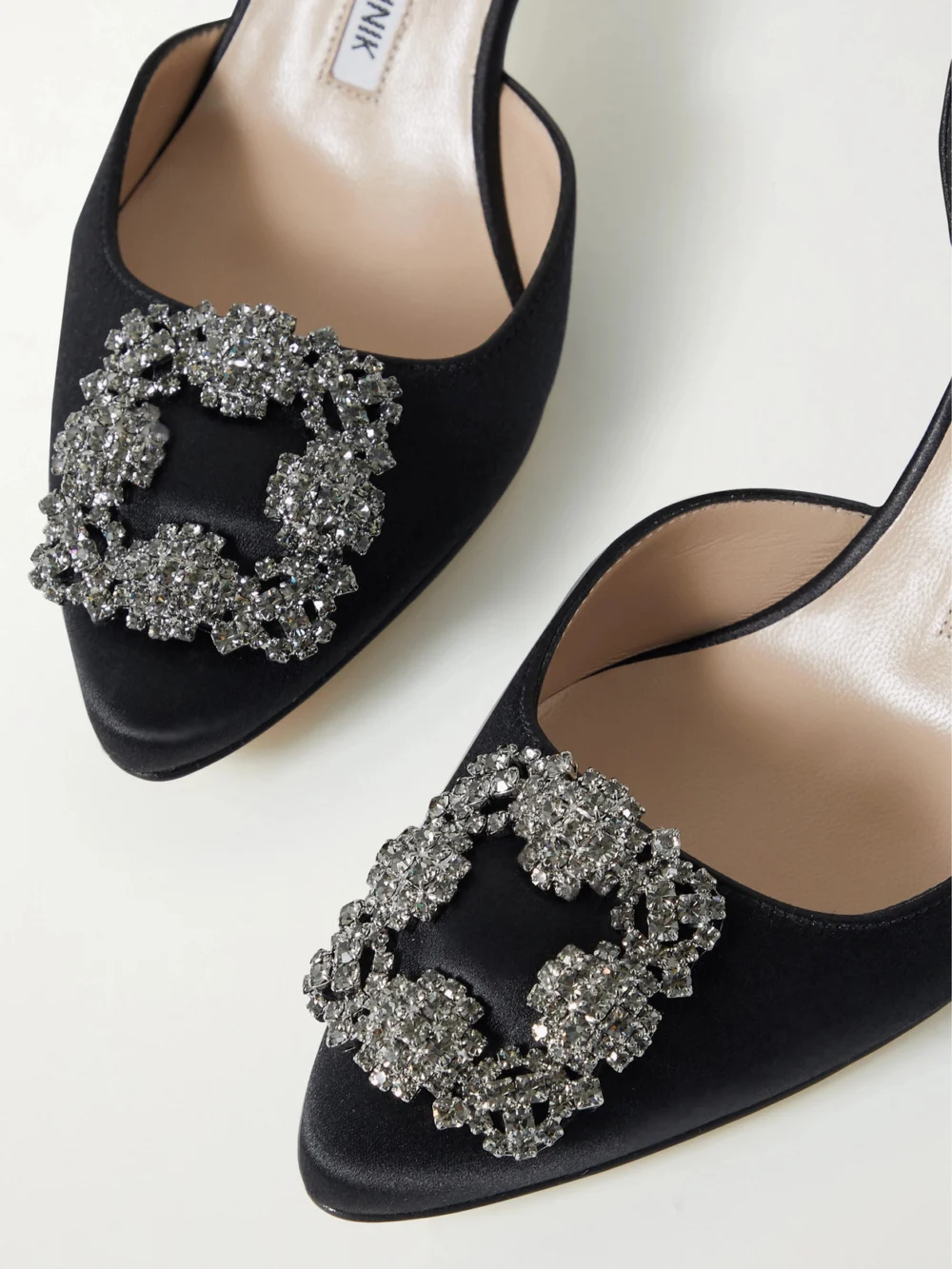 Close-up detail of the Manolo Blahnik Hangisli 70 Embellished Satin Slingback Pumps