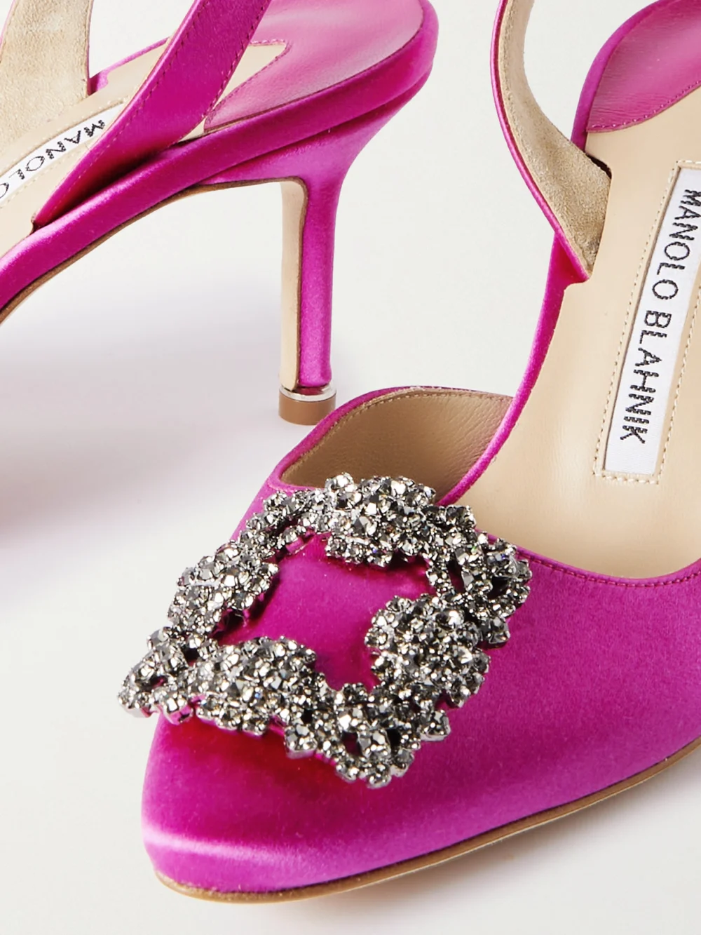 Close-up detail of the Manolo Blahnik Hangisli 70 Embellished Satin Slingback Pumps