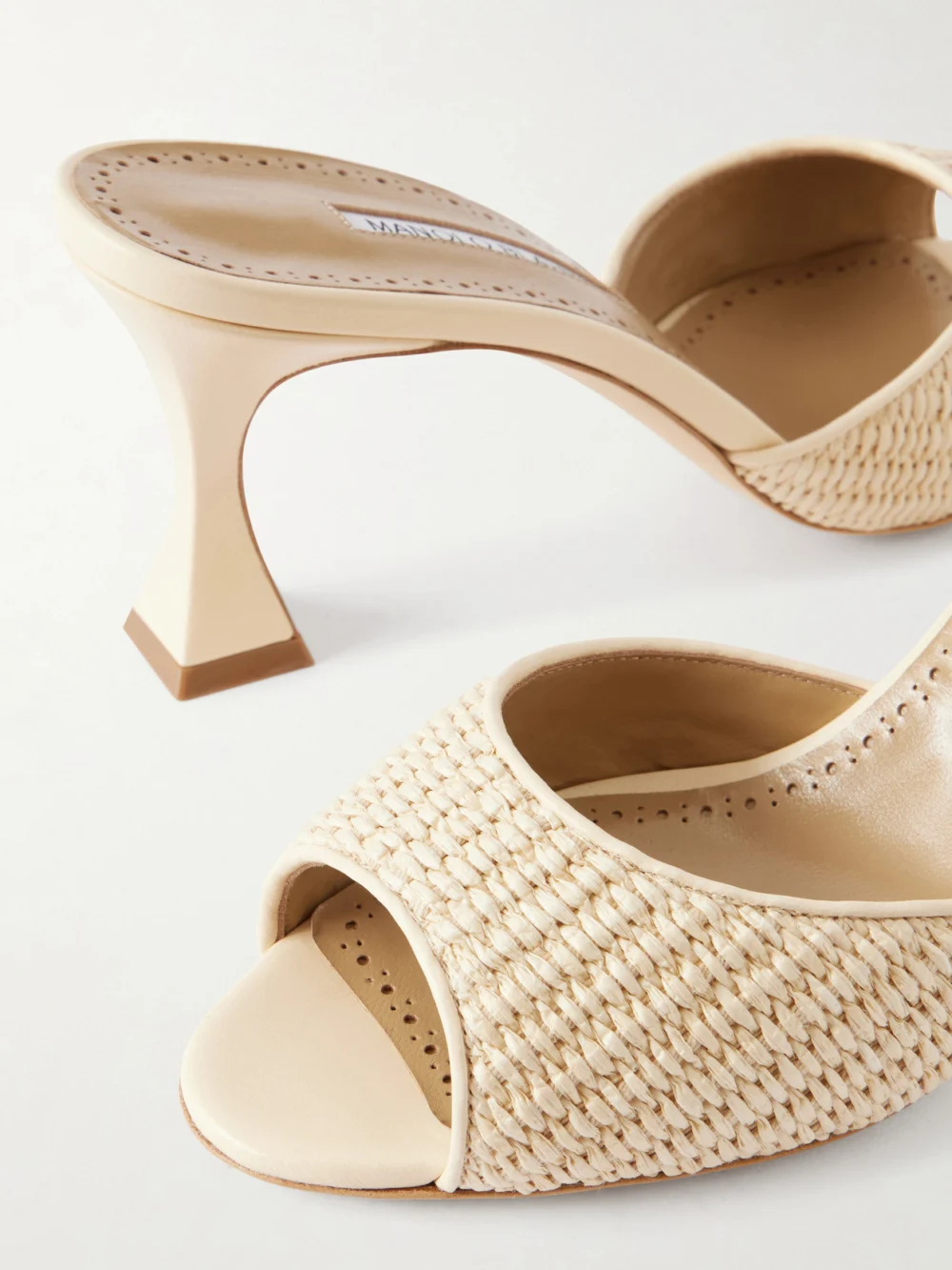 Close-up detail of the Manolo Blahnik Jadara 70 Leather-trimmed Raffia Mules