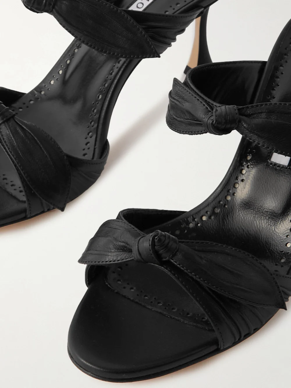 Close-up detail of the Manolo Blahnik Lollo 70 Bow-embellished Leather Mules