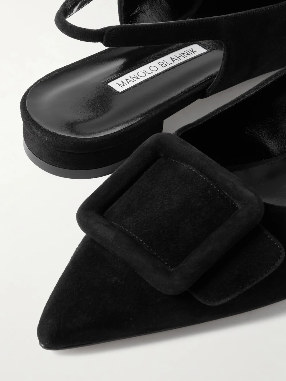 Close-up detail of the Manolo Blahnik Maylura Buckled Suede Slingback Flats