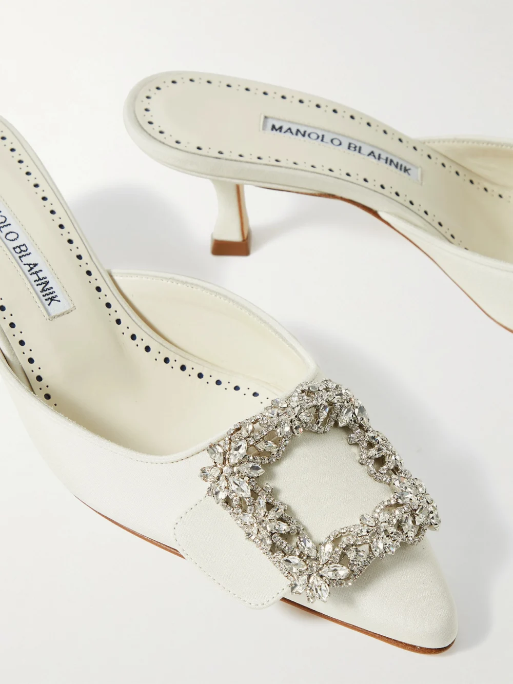 Close-up detail of the Manolo Blahnik Maysale 50 Buckled Crepe De Chine Mules