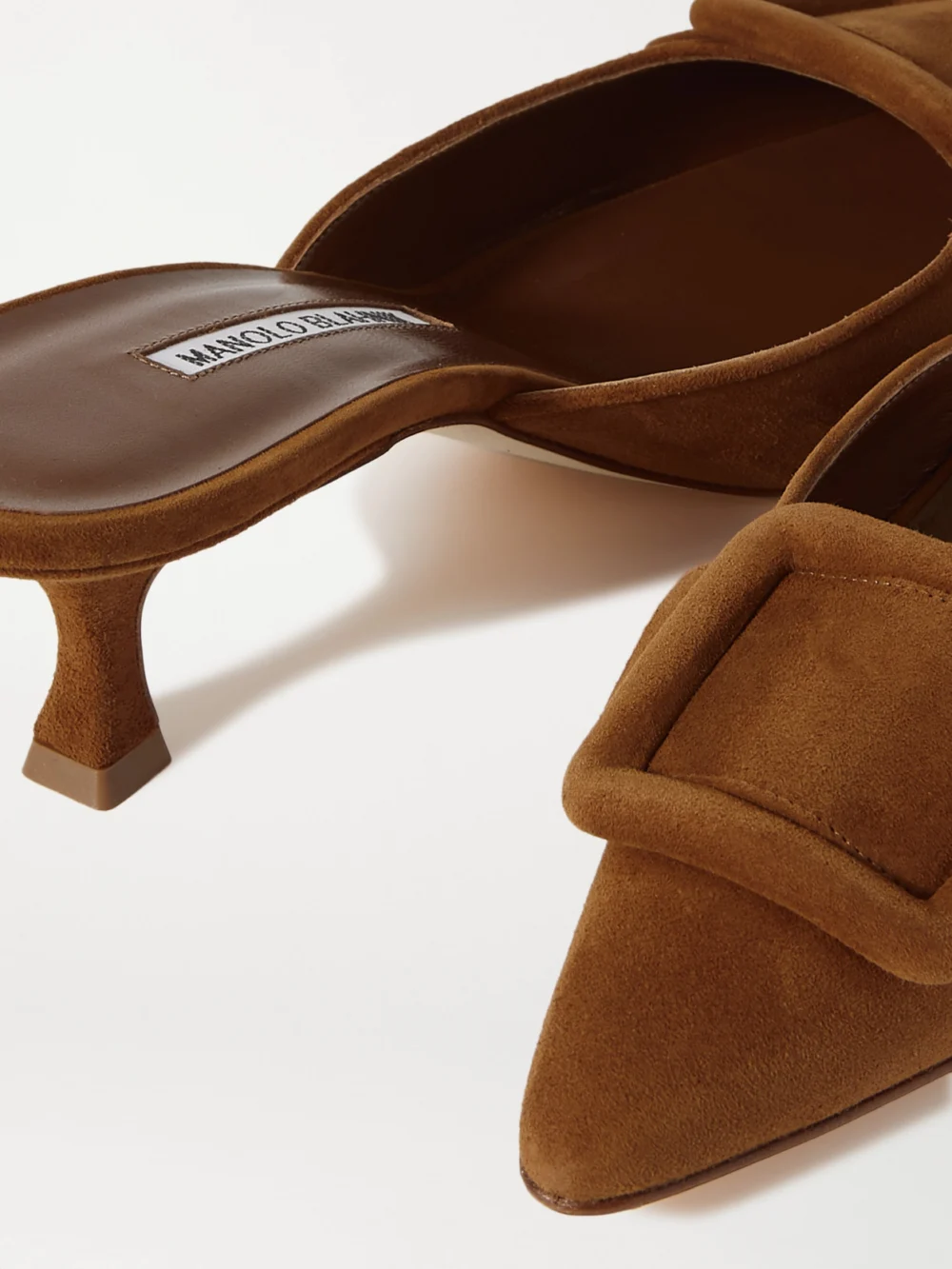 Close-up detail of the Manolo Blahnik Maysale 50 Buckled Suede Mules