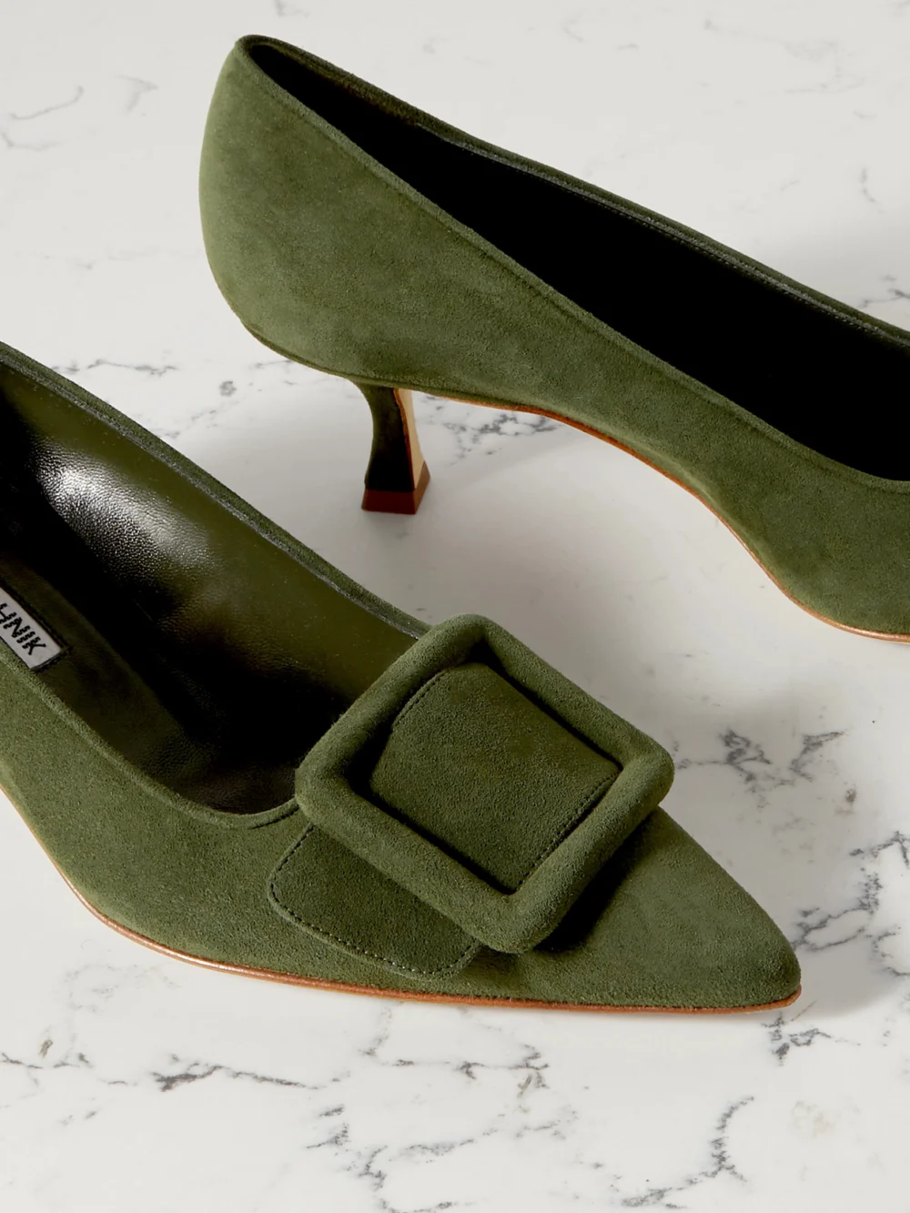 Close-up detail of the Manolo Blahnik Maysale 50 Buckled Suede Pumps