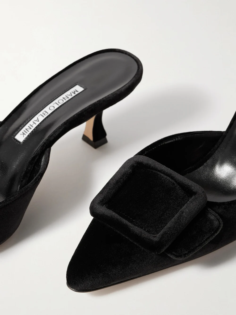 Close-up detail of the Manolo Blahnik Maysale 50 Buckled Velvet Mules