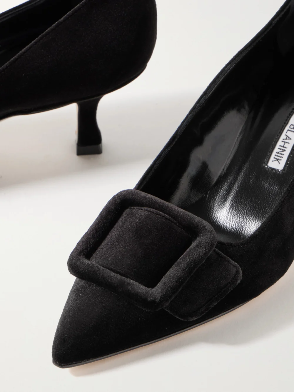 Close-up detail of the Manolo Blahnik Maysale 50 Buckled Velvet Pumps