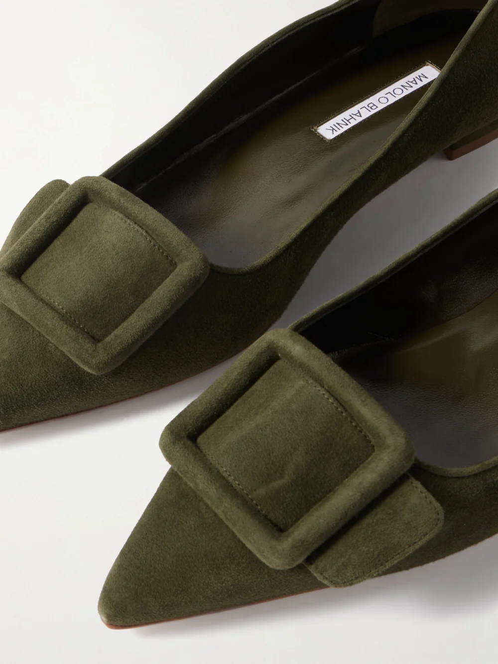 Close-up detail of the Manolo Blahnik Maysale Buckled Suede Point-toe Flats