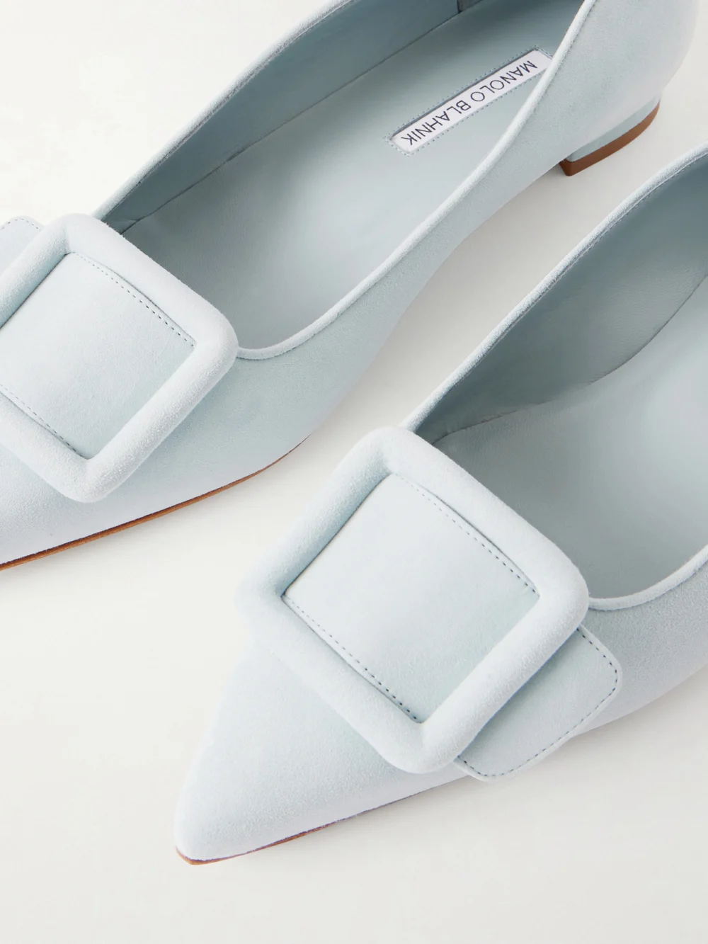 Close-up detail of the Manolo Blahnik Maysale Buckled Suede Point-toe Flats