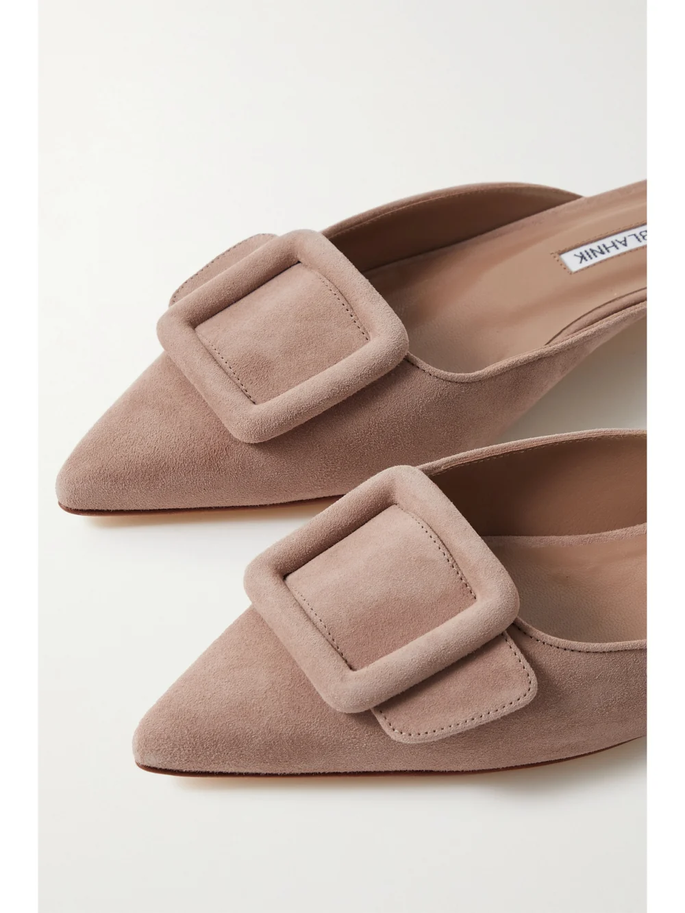 Close-up detail of the Manolo Blahnik Maysale Buckled Suede Point-toe Flats