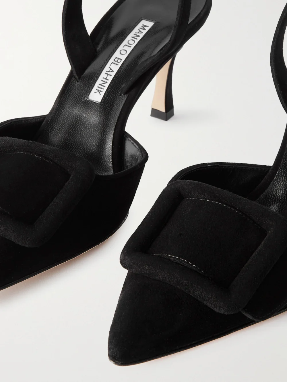 Close-up detail of the Manolo Blahnik Maysli 70 Buckled Suede Slingback Pumps