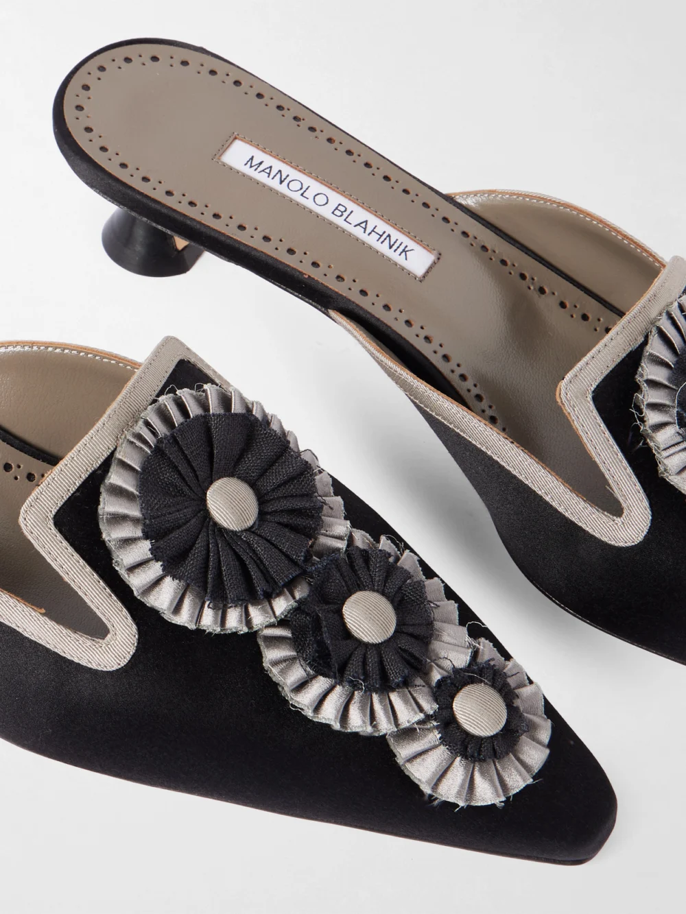 Close-up detail of the Manolo Blahnik Merode 30 Grosgrain-trimmed Satin Mules