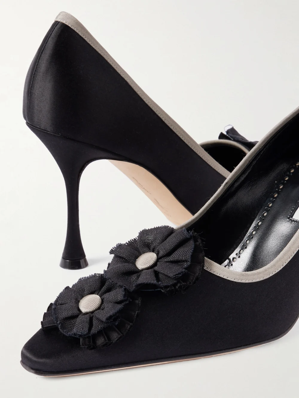 Close-up detail of the Manolo Blahnik Montmedy 95 Grosgrain-trimmed Appliquéd Satin Pumps