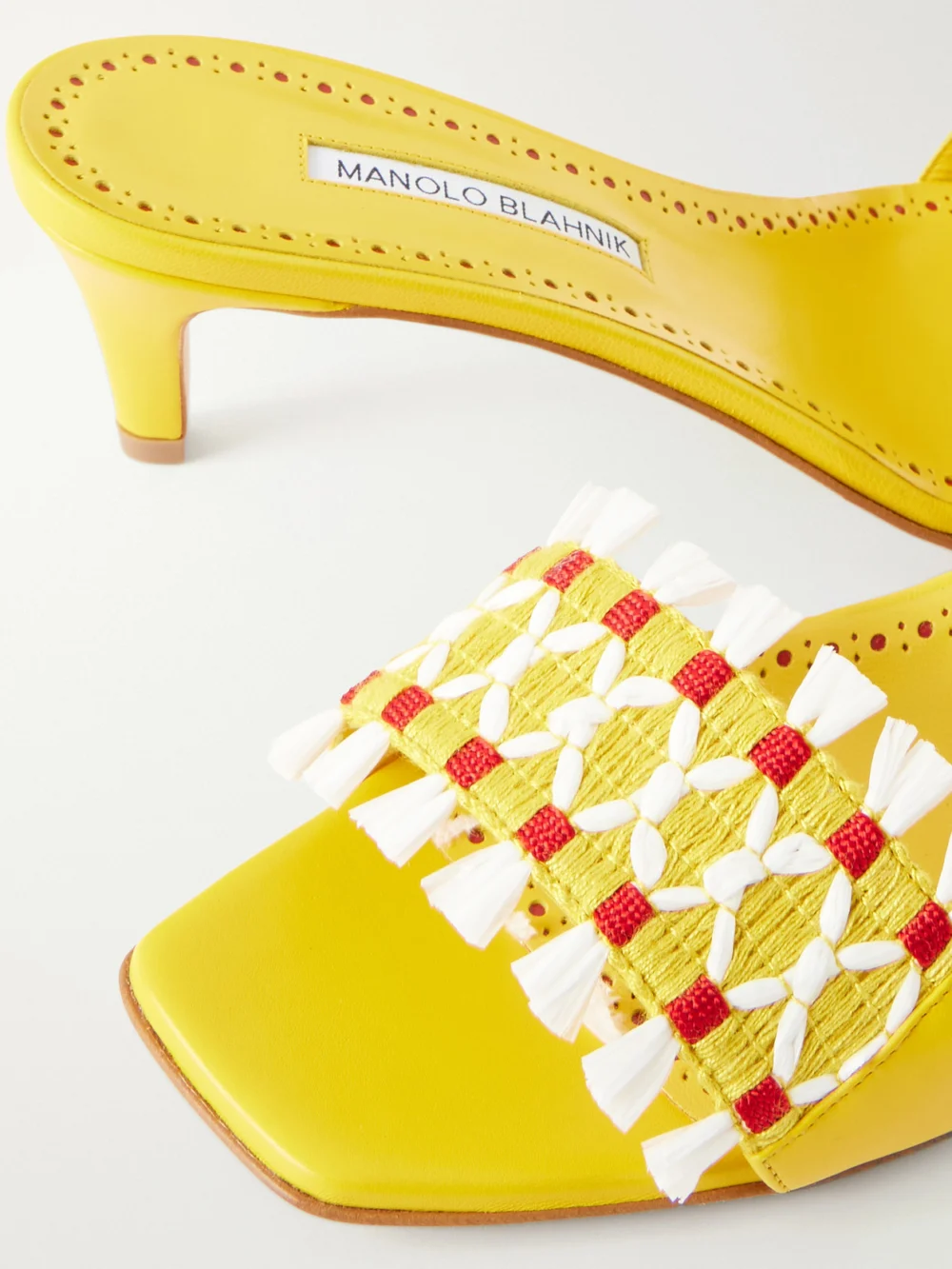 Close-up detail of the Manolo Blahnik Moremu 50 Raffia-trimmed Leather Mules