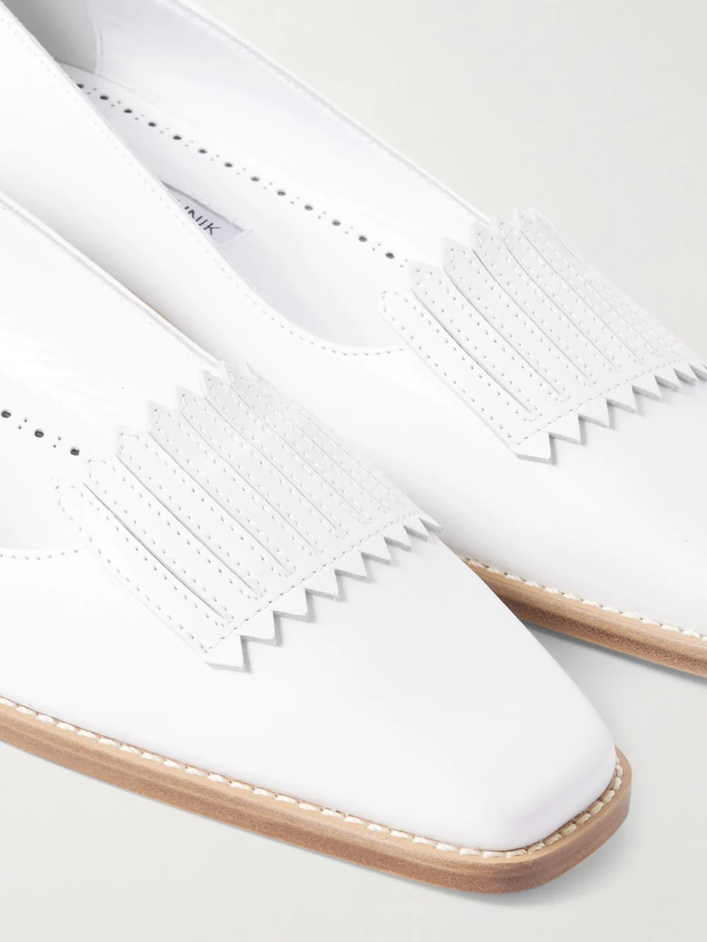 Close-up detail of the Manolo Blahnik Pausaniasflat Fringed Leather Loafers