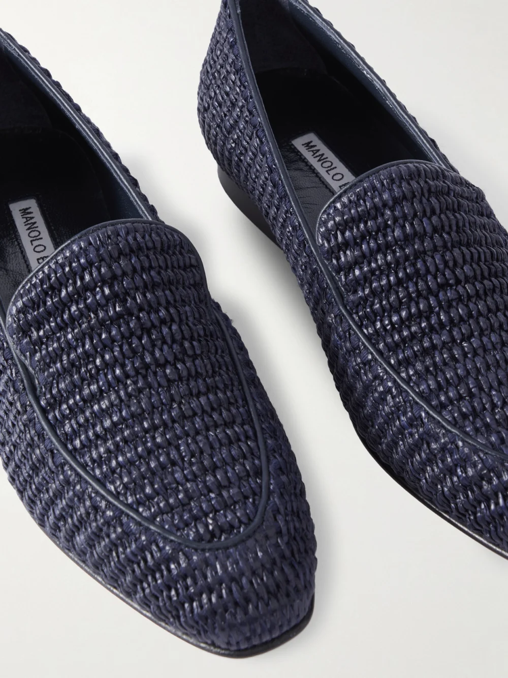 Close-up detail of the Manolo Blahnik Pitakara Leather-trimmed Raffia Loafers
