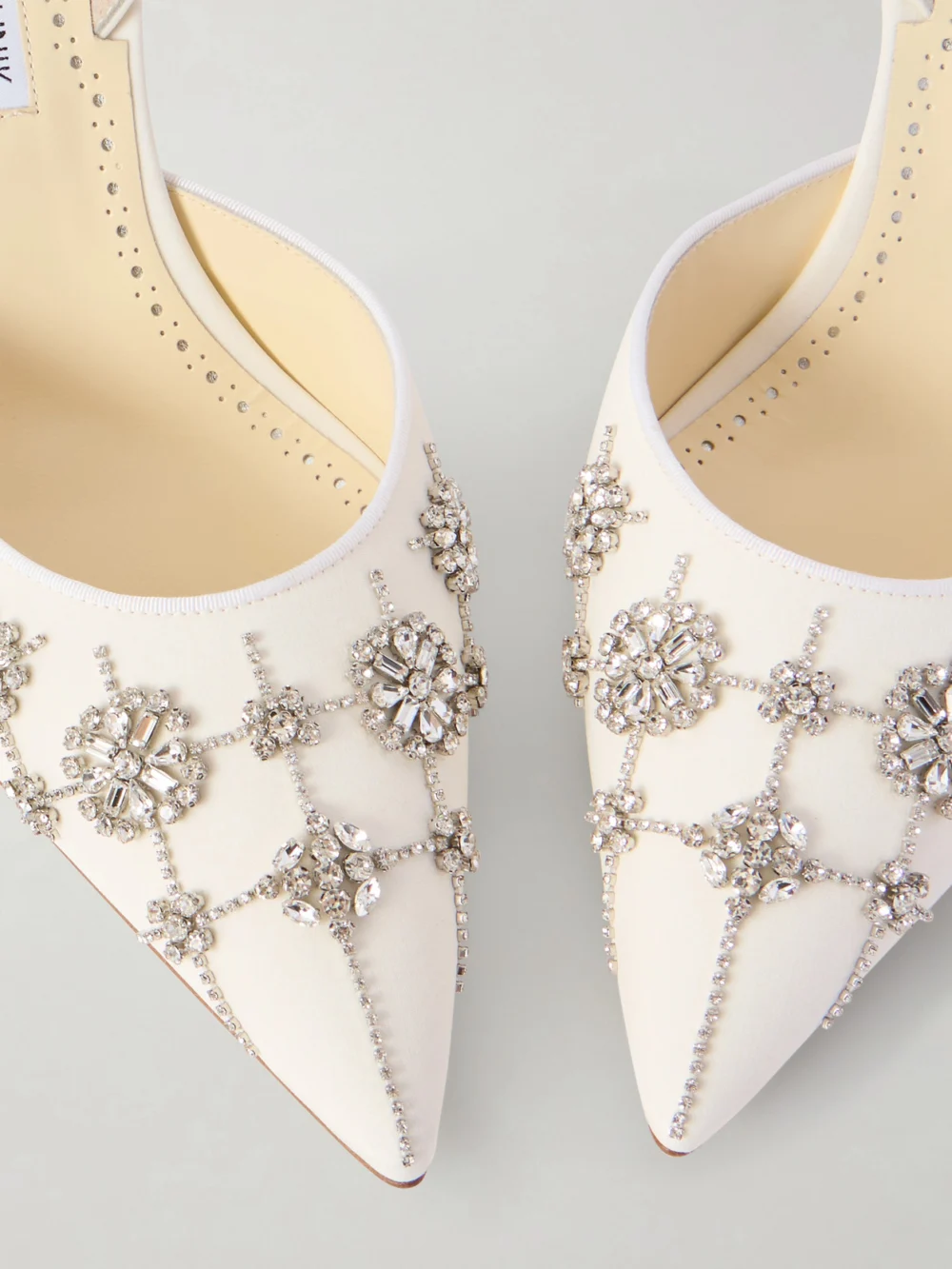 Close-up detail of the Manolo Blahnik Ralyne 90 Crystal-embellished Crepe De Chine Slingback Pumps