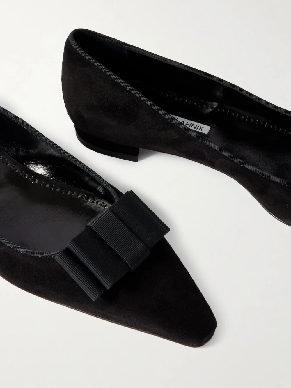 Close-up detail of the Manolo Blahnik Reador 10 Bow-detailed Suede Point-toe Flats