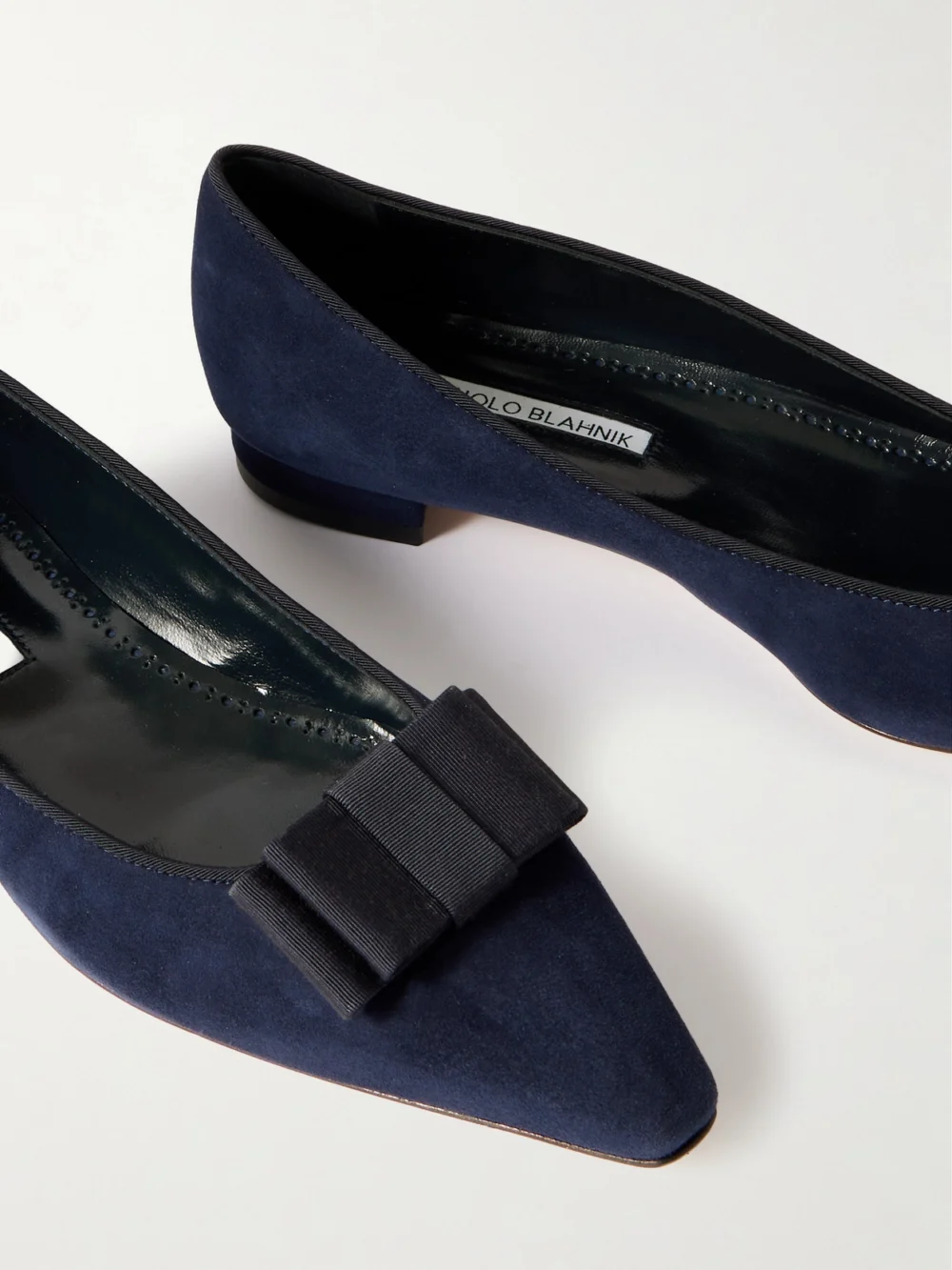 Close-up detail of the Manolo Blahnik Reador 10 Bow-detailed Suede Point-toe Flats