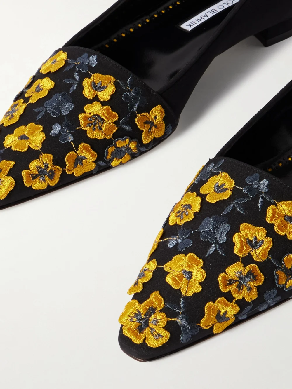 Close-up detail of the Manolo Blahnik Safiye Embroidered Crepe De Chine Point-toe Flats