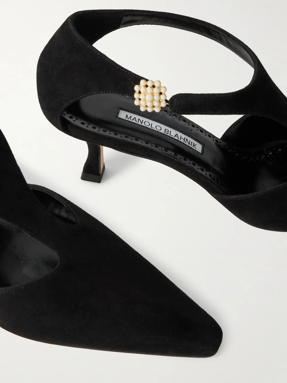 Close-up detail of the Manolo Blahnik Shufta 50 Embellished Suede Pumps