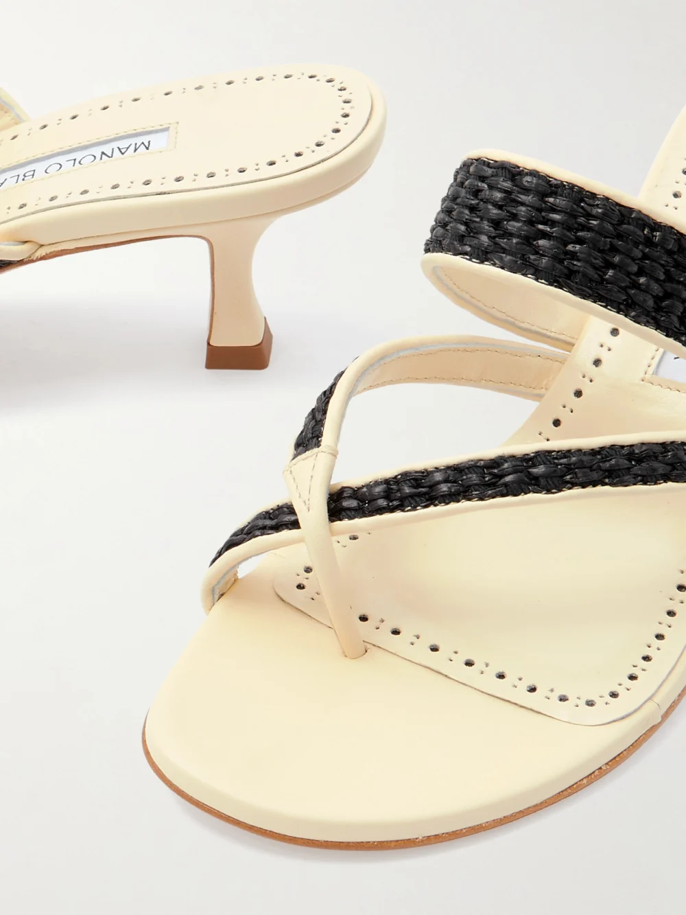 Close-up detail of the Manolo Blahnik Susa 50 Raffia-trimmed Leather Mules