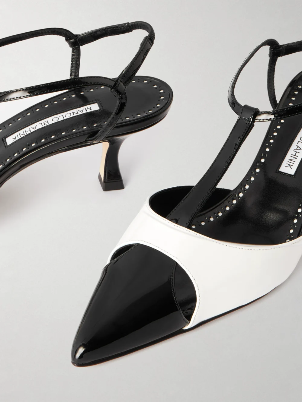 Close-up detail of the Manolo Blahnik Turgimod 50 Two-tone Patent-leather Pumps