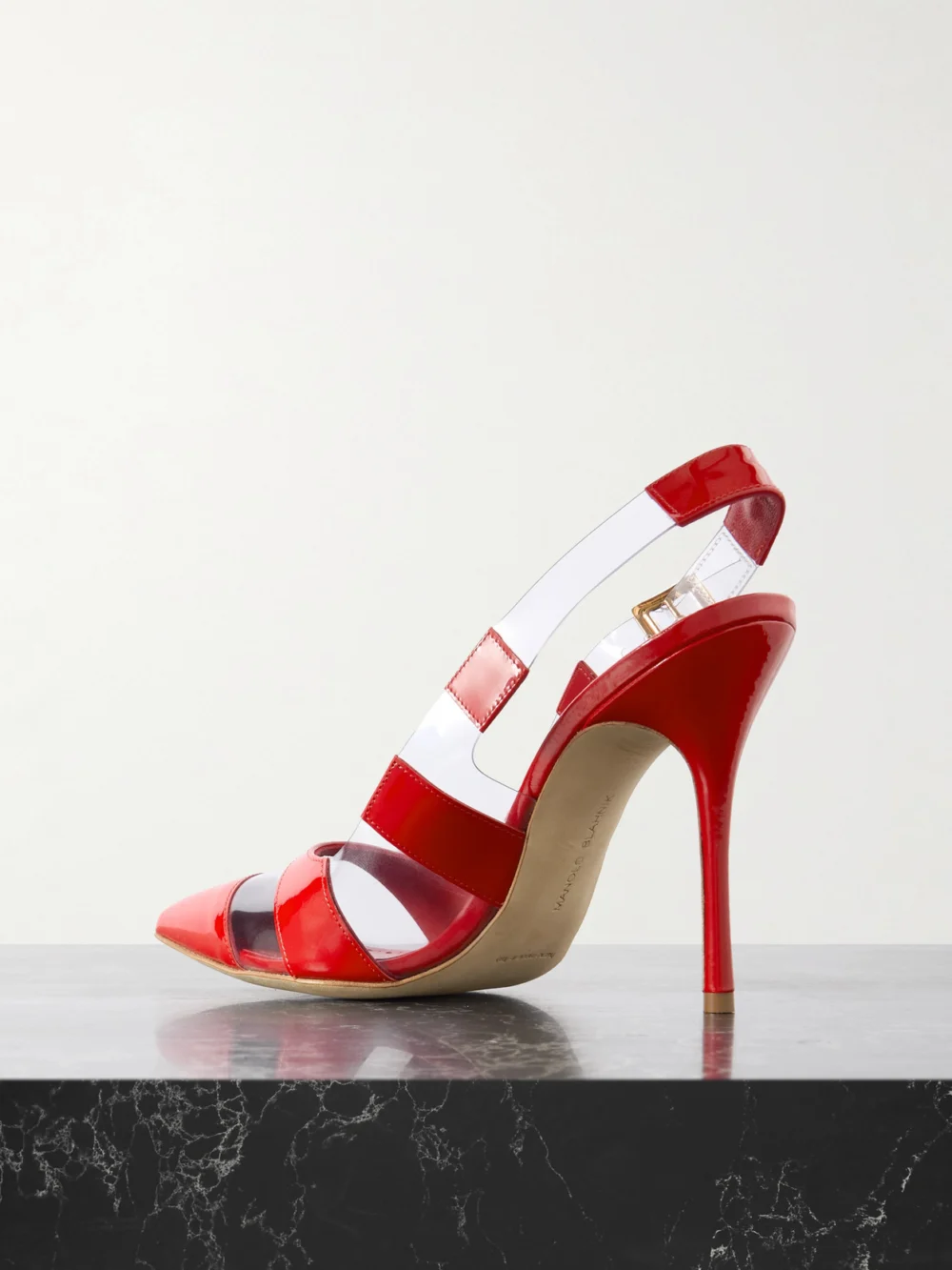 Back view of the Manolo Blahnik Uxra 105 Patent-leather and Pvc Slingback Pumps