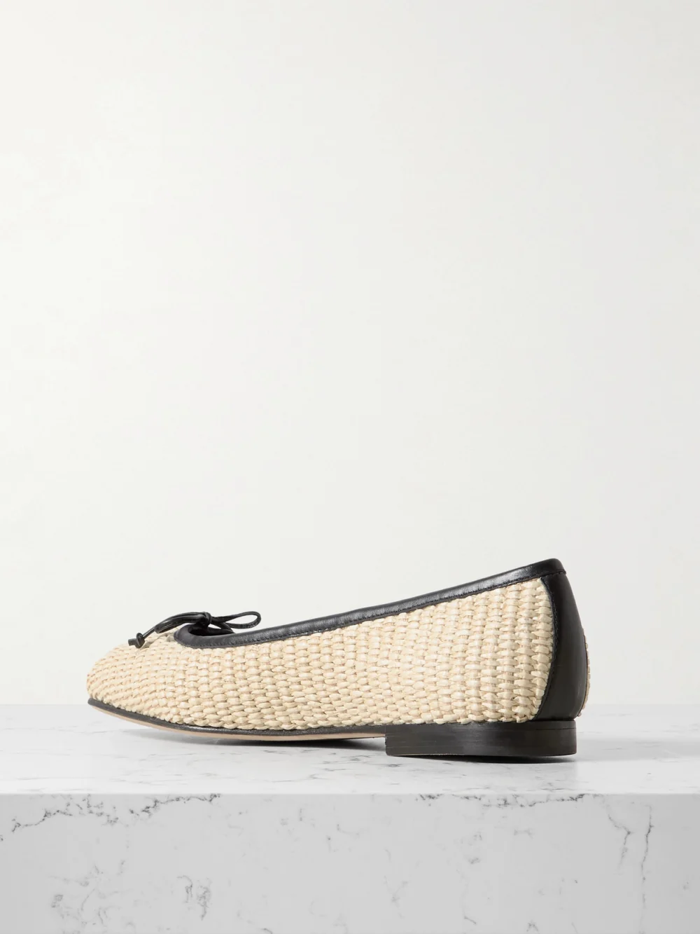 Back view of the Manolo Blahnik Veralli Leather-trimmed Raffia Ballet Flats