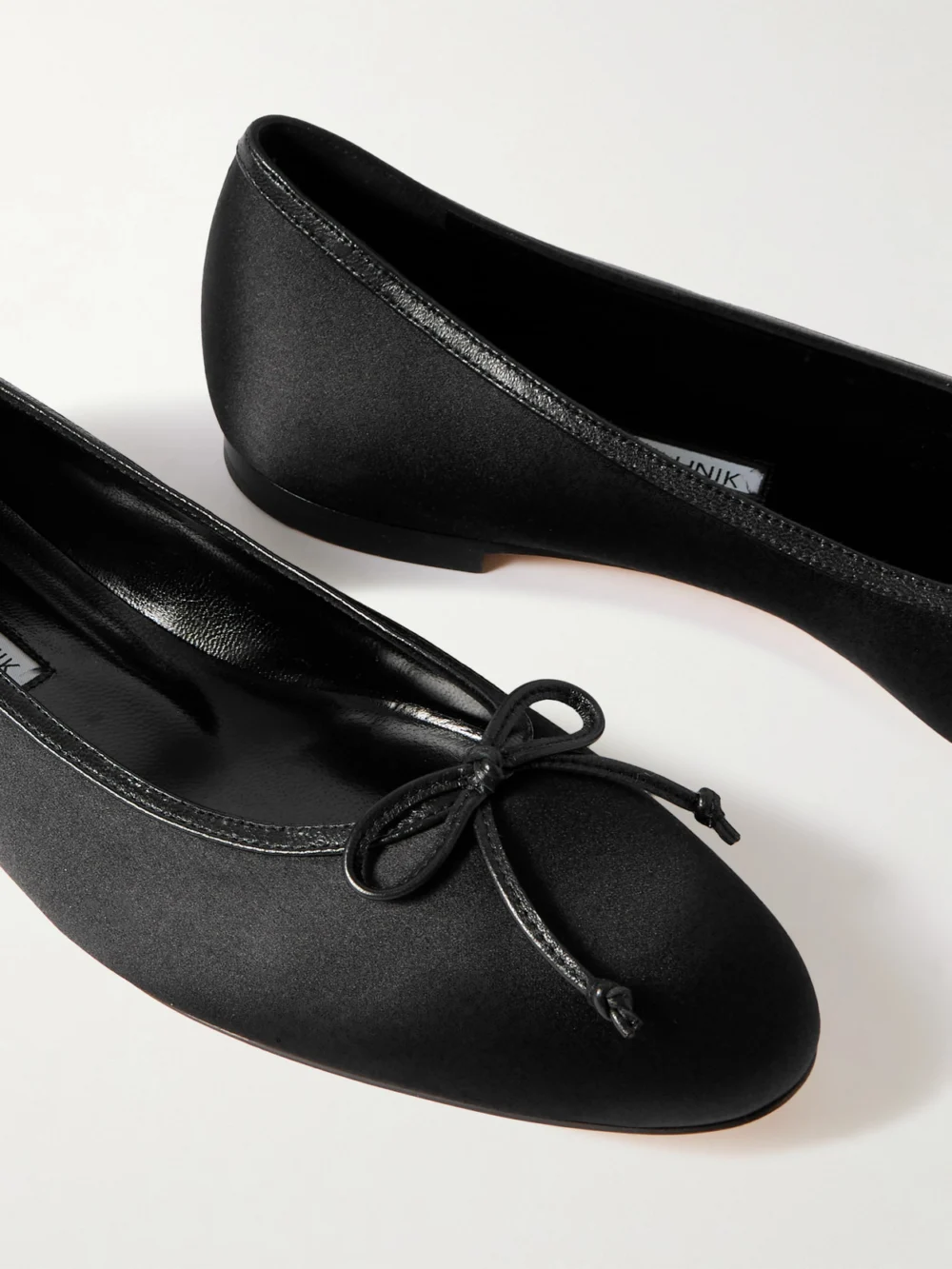 Close-up detail of the Manolo Blahnik Verallim 10 Bow-detailed Leather-trimmed Satin Ballet Flats