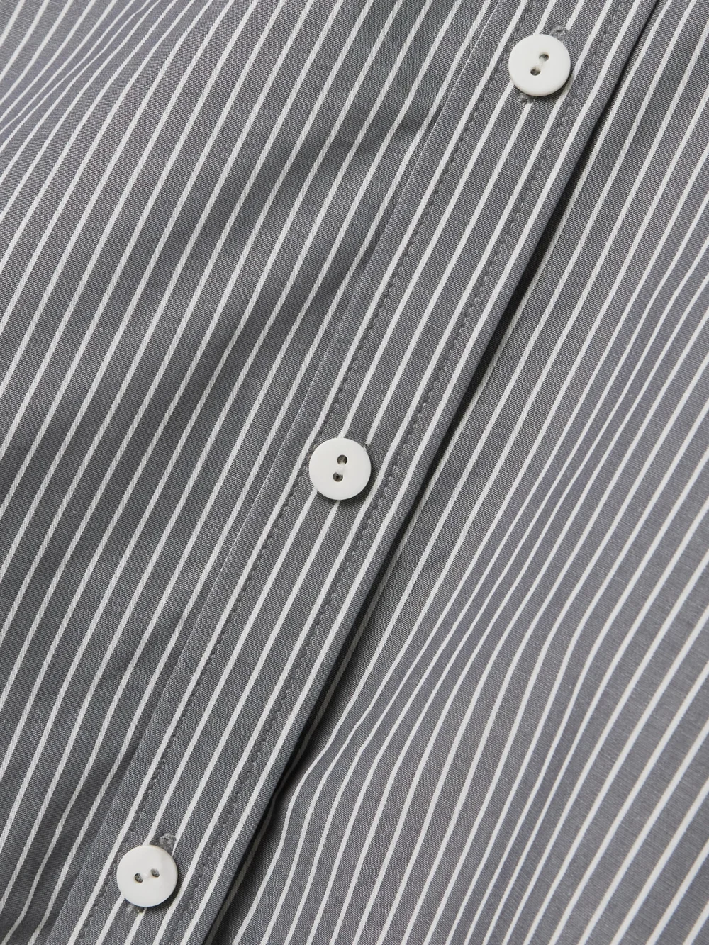 Close-up detail of the Maria McManus Cropped Striped Organic Cotton Shirt