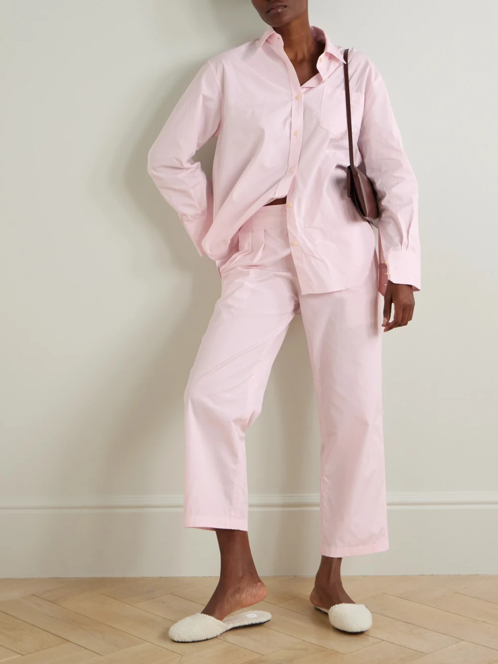 Maria McManus Pleated Organic Cotton-poplin Tapered Pants, worn by a model