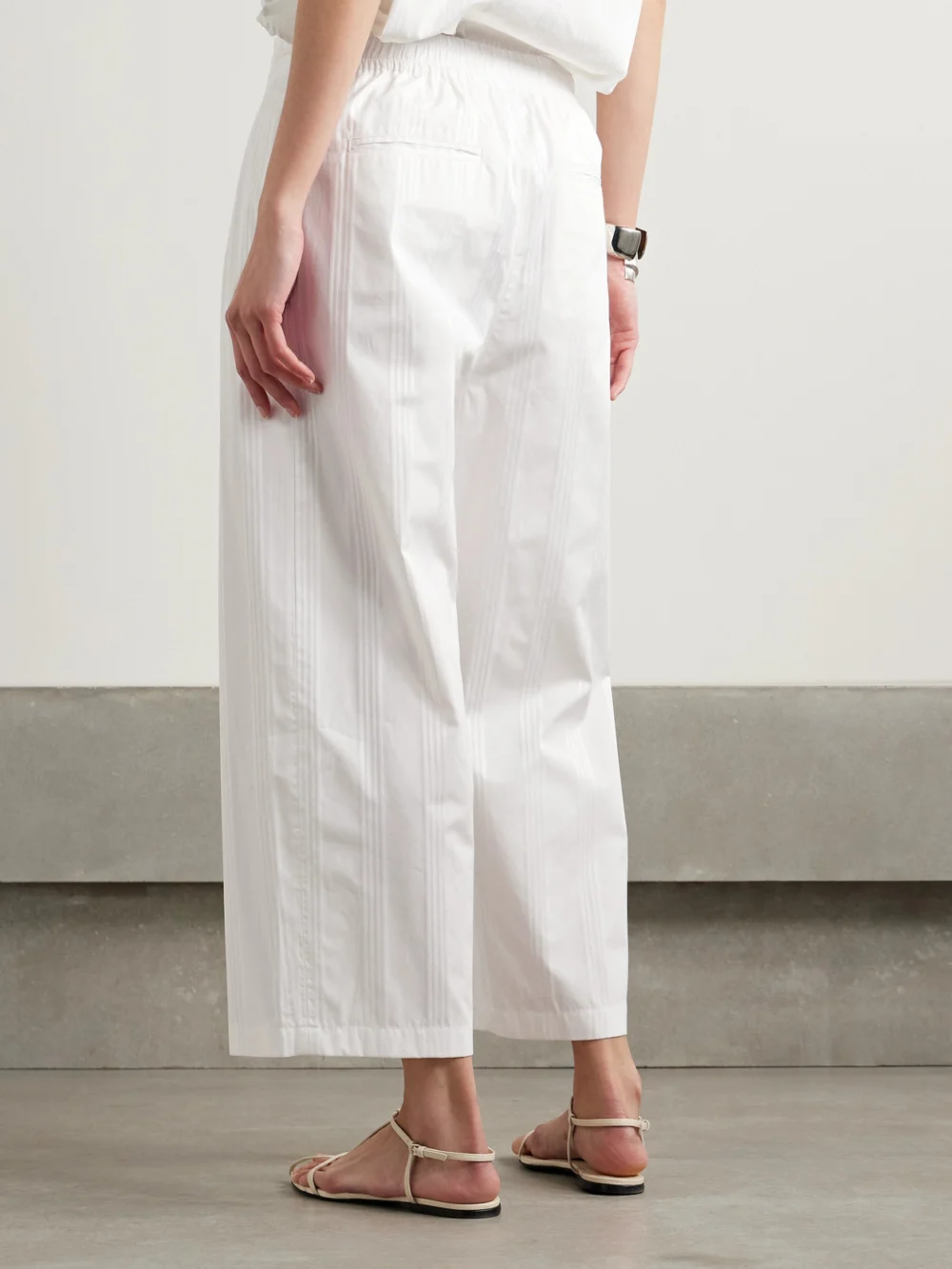 Back view of the Maria McManus Pleated Striped Organic Cotton-jacquard Wide-leg Pants