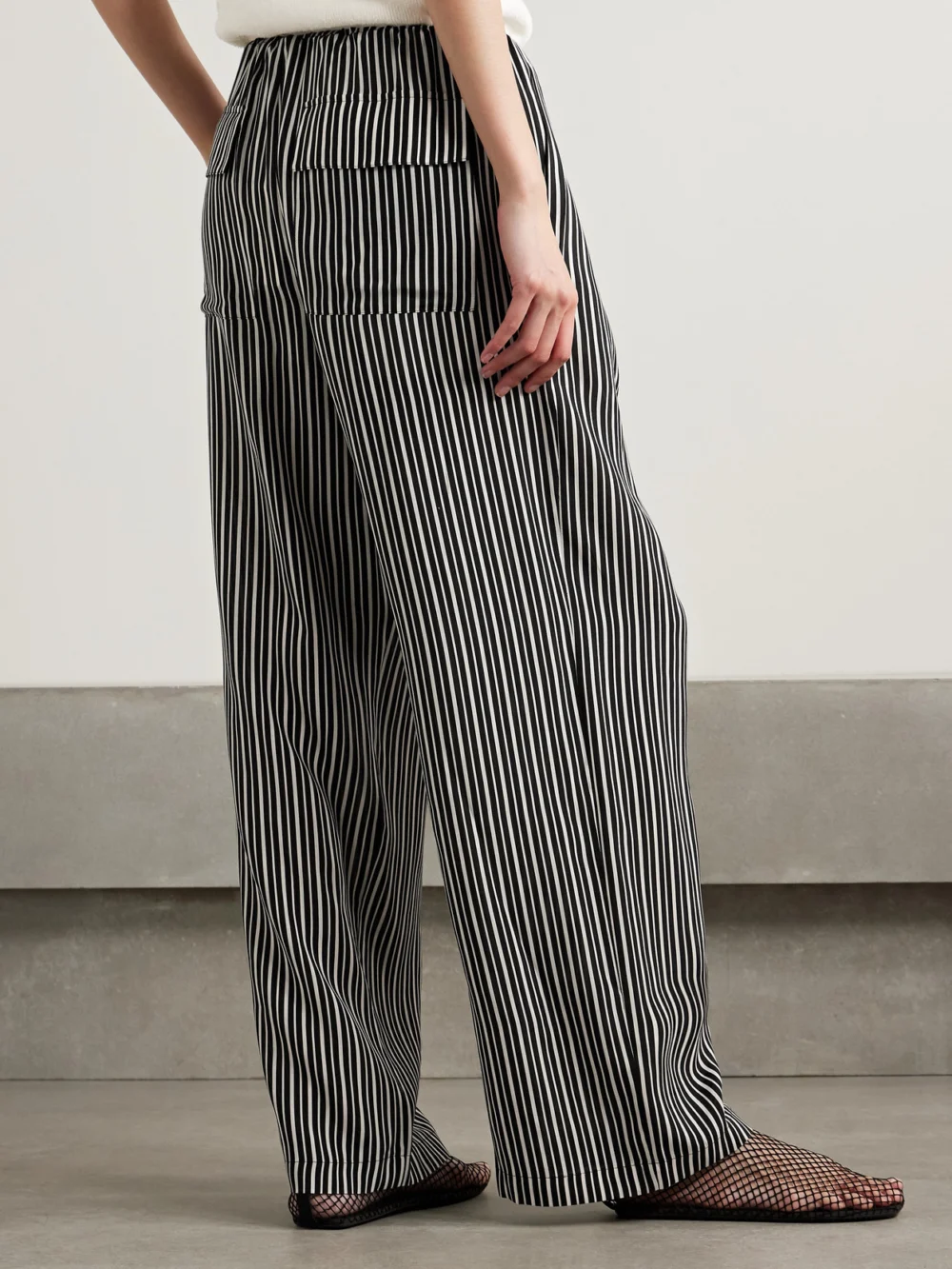 Back view of the Maria McManus Pleated Striped Recycled-crepe De Chine Straight-leg Pants