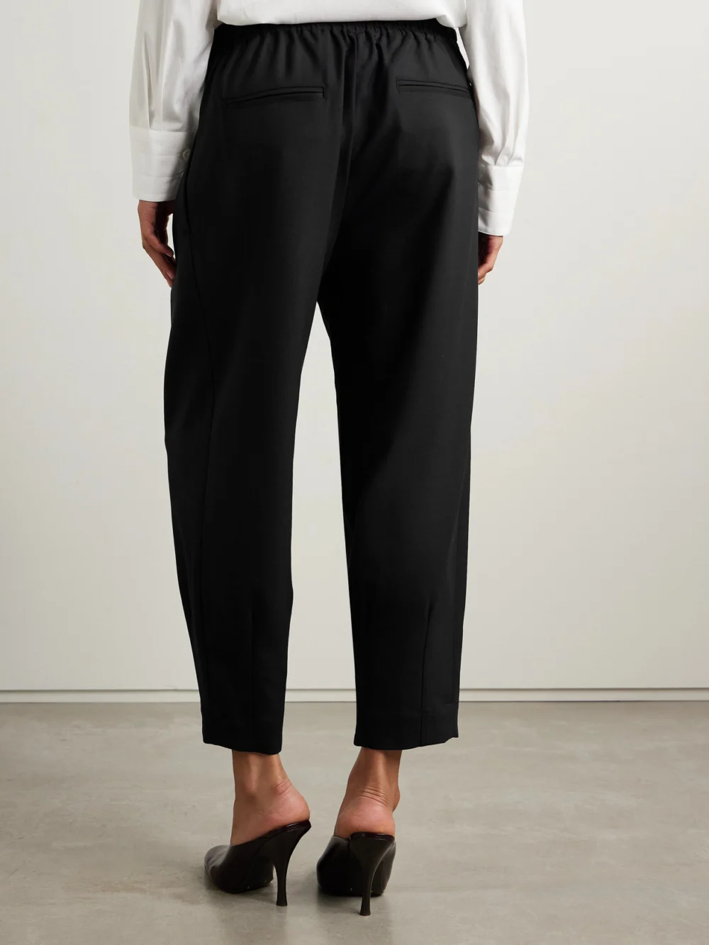 Back view of the Maria McManus Pleated Wool-blend Tapered Pants