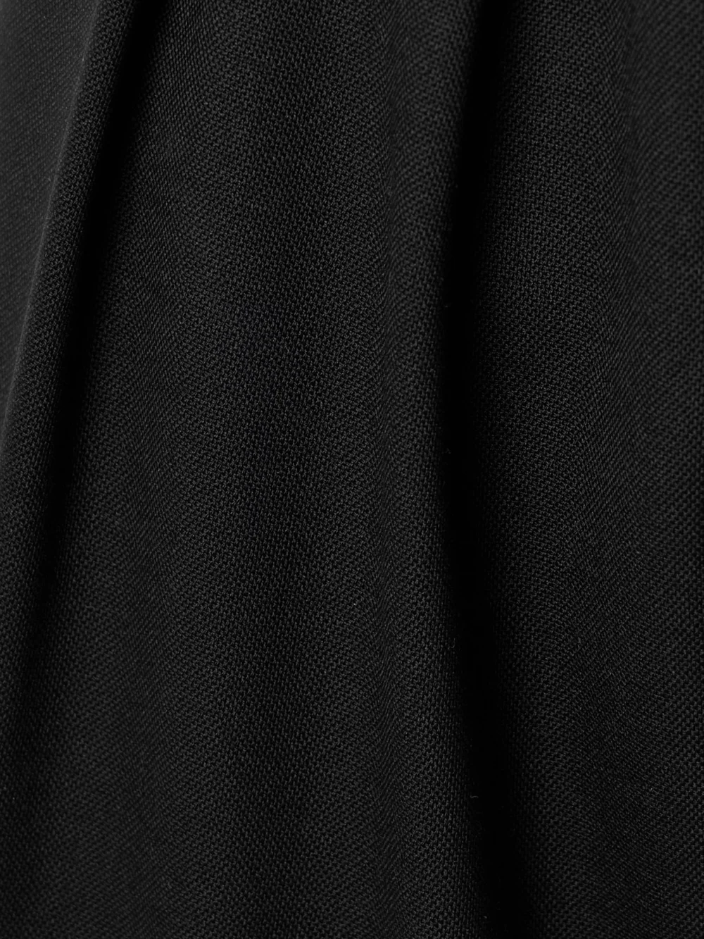 Close-up detail of the Maria McManus Pleated Wool-blend Tapered Pants