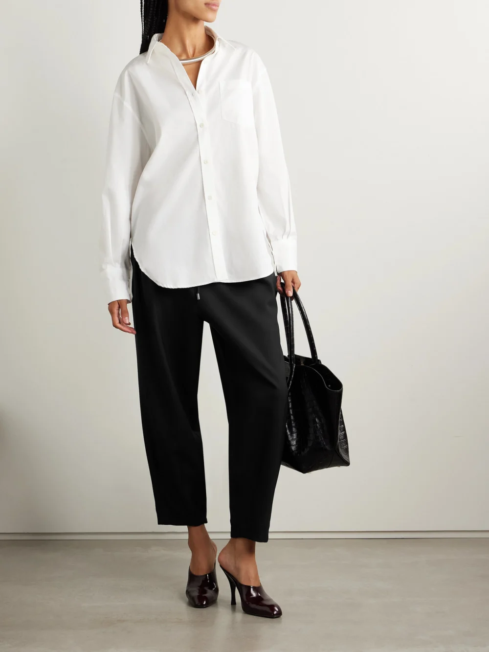 Maria McManus Pleated Wool-blend Tapered Pants, worn by a model